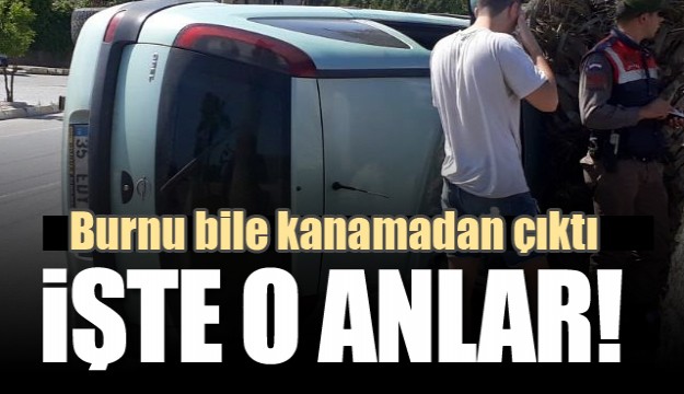 Antalya'da Devrilen otomobilden burnu kanamadan çıktı