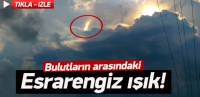 Bulutların arasında dans eden esrarengiz ışık