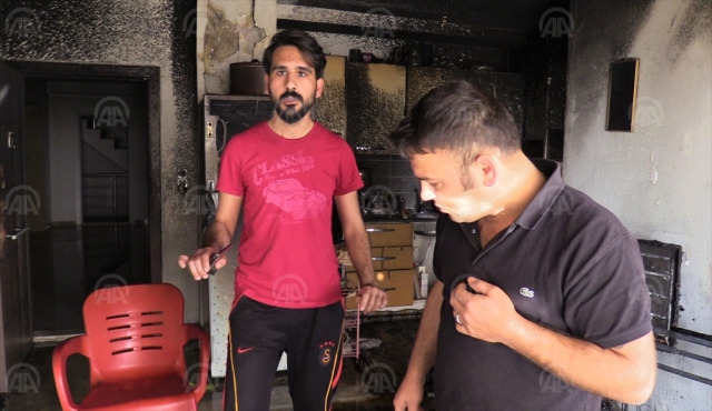 Yangında balkondan atlayan genç kızı havada yakaladı